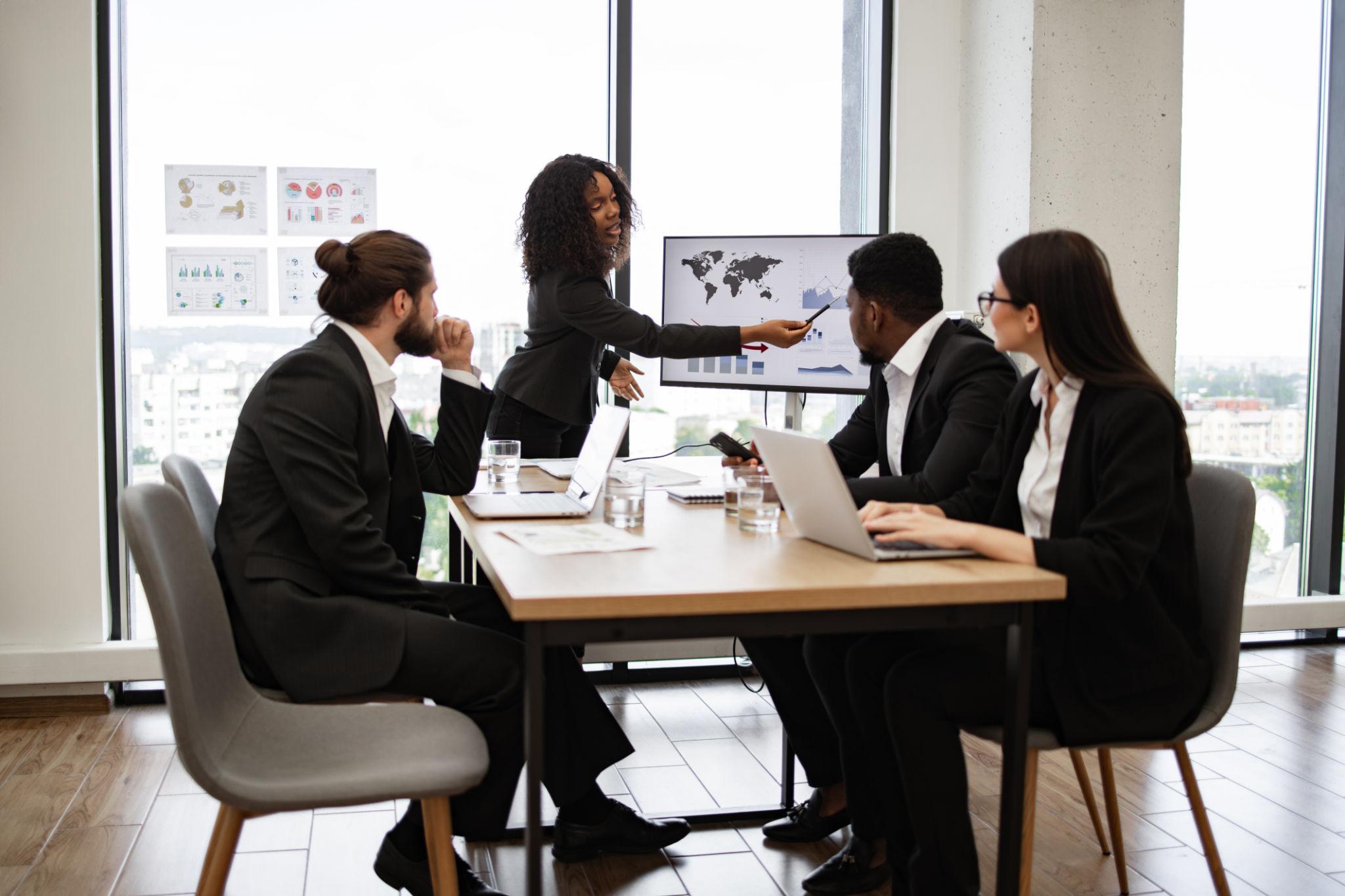 Business professionals analyzing data using decision engine technology